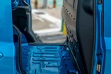 Ford E-Transit Courier blauw zijkant met open schuifdeuren